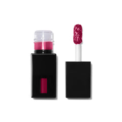 e.l.f. Glossy Lip Stain tube closeup, bold color on a sleek package.