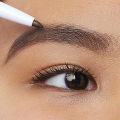 e.l.f. Instant Lift Brow Pencil spoolie action shaping brows for natural definition.
