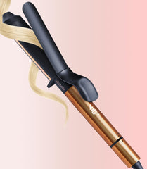 ELLA BELLA Curling Iron 1.25-inch in hand for quick, polished curls