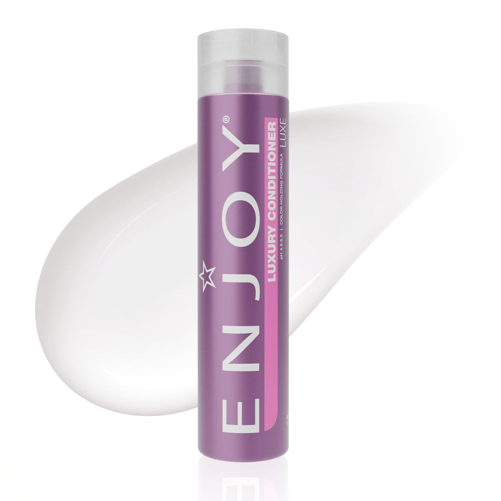 Enjoy Luxury Conditioner bottle pour shows easy dispensing for frizz control and moisture.