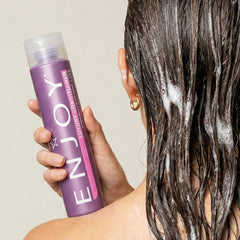 Enjoy Luxury Conditioner wet hair application demonstrates detangling and smoothing while styling.