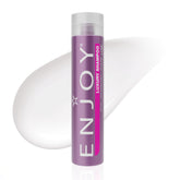 Enjoy Luxury Shampoo bottle demonstrates frizz-control for sleek, manageable hair.