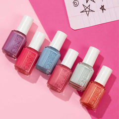 essie nail polish bottle close-up with vibrant blue cream finish.