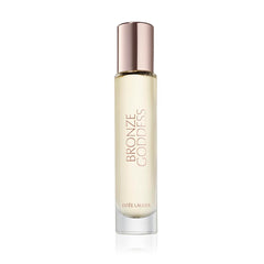 Estee Lauder Bronze Goddess Eau Fraiche bottle glows in warm light, great for daytime radiance.