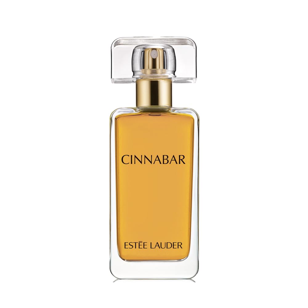 Estée Lauder Cinnabar bottle front view highlighting warm amber tones.
