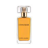 Estée Lauder Cinnabar bottle front view highlighting warm amber tones.