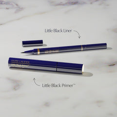 Estée Lauder Little Black Primer Tint wand applying for defined lash base.