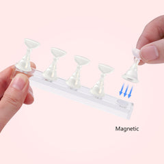 Etercycle magnetic-base close-up demonstrates firm hold during detailed nail art.