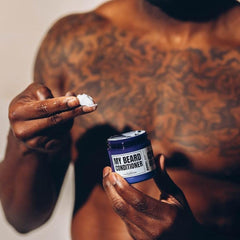 Applying Evan Alexander Grooming beard conditioner shows a smooth finish and frizz reduction.