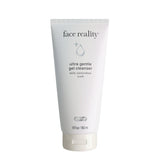 Face Reality Ultra Gentle Cleanser bottle on bathroom shelf for daily makeup removal.