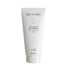 Face Reality Ultra Gentle Cleanser bottle on bathroom shelf for daily makeup removal.