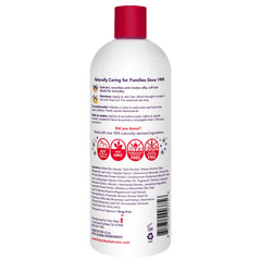 Child applying Fairy Tales Rosemary Repel conditioner to damp hair for easier brushing.
