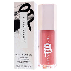 Fenty Beauty Gloss Bomb Lip Oil applicator in action on lips.