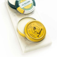 Feret Parfumeur Rose Powder Balm on hands for quick moisture