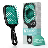 FHI Heat UNbrush detangling bristles ease knot removal across hair types.