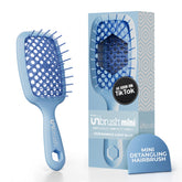 FHI Heat UNbrush Mini Detangler Brush front view, travel-ready for painless detangling