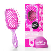 FHI Heat UNbrush Mini Detangler front view, compact travel-ready design for easy packing.