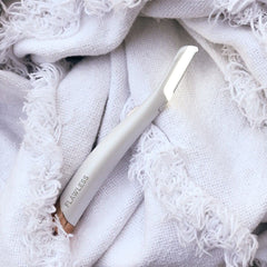 Finishing Touch Flawless Dermaplane Glo LED light helps you see every spot clearly.