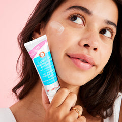 First Aid Beauty Hello FAB 2-in-1 formula demonstrated as makeup grip and moisturizer.