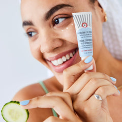 Application of First Aid Beauty eye cream for day and night use around eyes