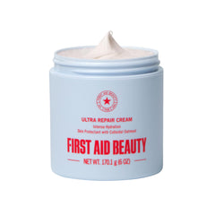 First Aid Beauty Ultra Repair Cream jar close-up showing rich, non-greasy hydration.