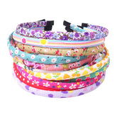 Fishdown headbands with floral cloth cover add gentle color to a girl's hair.