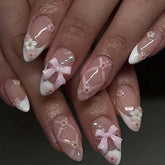 Foccna almond-bling pink nails with rhinestones for at-home manicure.