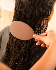 FRAMAR chocolate brush massages the scalp to promote healthy-looking hair