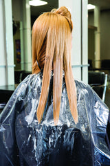 Framar protects chair and cape with disposable sheets for a cleaner salon.