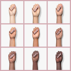 Aplicación de capa base en uñas para mejor adherencia y duración.