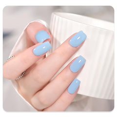 GAOY Light Blue Gel Nail Polish under UV lamp, quick 60-second cure for drying.
