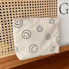 Compact 25 cm by 18 cm pouch that fits in purses and totes.