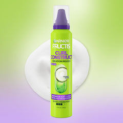 Garnier Fructis Curl Construct Mousse dispense action highlighting easy application.