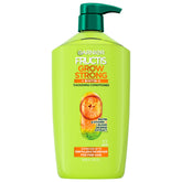 Frasco de acondicionador Garnier Fructis Grow Strong para cabello fino con mayor volumen.