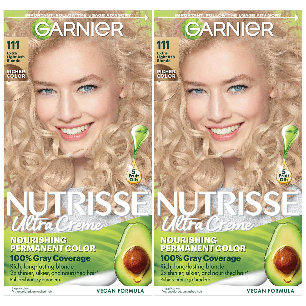 Garnier Nutrisse Ultra Creme bottle poured for even application.