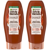Garnier Whole Blends botella con aceite de coco y cacao para suavidad y aroma exótico