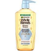 Garnier Whole Blends botella de champú miel-agua para hidratación duradera