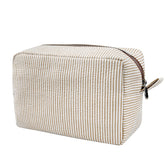 GFU seersucker cosmetic bag in brown fabric with soft texture for easy packing
