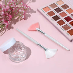 Giantree pink pearl-handled fan brush close-up for gentle mask application