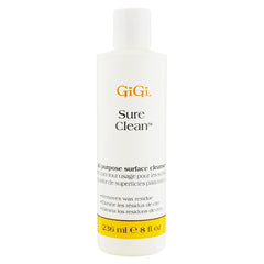 GIGI Sure Clean Wax Remover bottle pour demonstrates quick residue lifting for efficient cleanup.