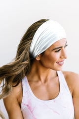 GiLi knotted headband white fashion shot; versatile workout styling