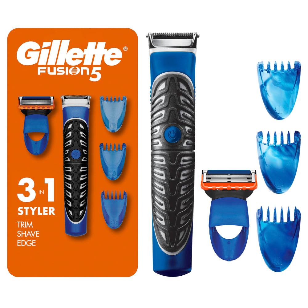Gillette Styler trimmer in hand for precise beard shaping.
