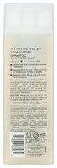 Giovanni Invigorating Tea Tree Shampoo bottle being poured for a cooling cleanse.