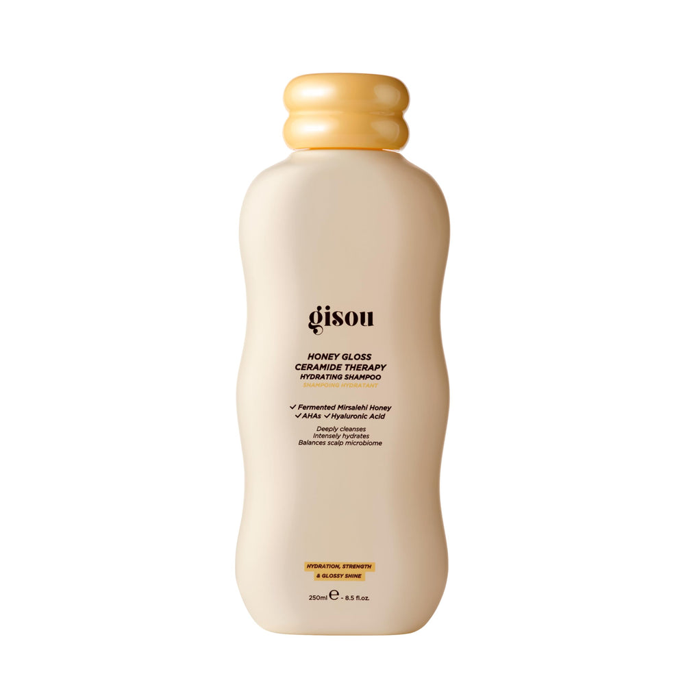 Gisou Honey Gloss Ceramide Therapy Shampoo bottle with shimmering shine.