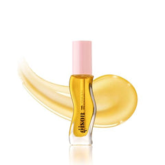 Gisou Honey Infused Lip Oil being applied on lips for smooth shine.
