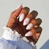 Glamnetic Fleur Amour nails kit with delicate pink blossoms on white base for elegant daily wear