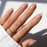 Glamnetic Glamzilla not your cinder-ella short almond nude nails with durable wear.