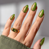 Glamnetic Mandrake short almond nails with iridescent glaze for a magical, long-wearing manicure.