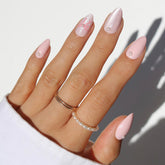 Glamnetic Love Knot pearls and bow close-up, showcasing intricate detail for a delicate manicure.