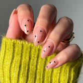 Glamnetic Pink Comet short almond nails in pale blush with a glossy finish for salon-inspired days.